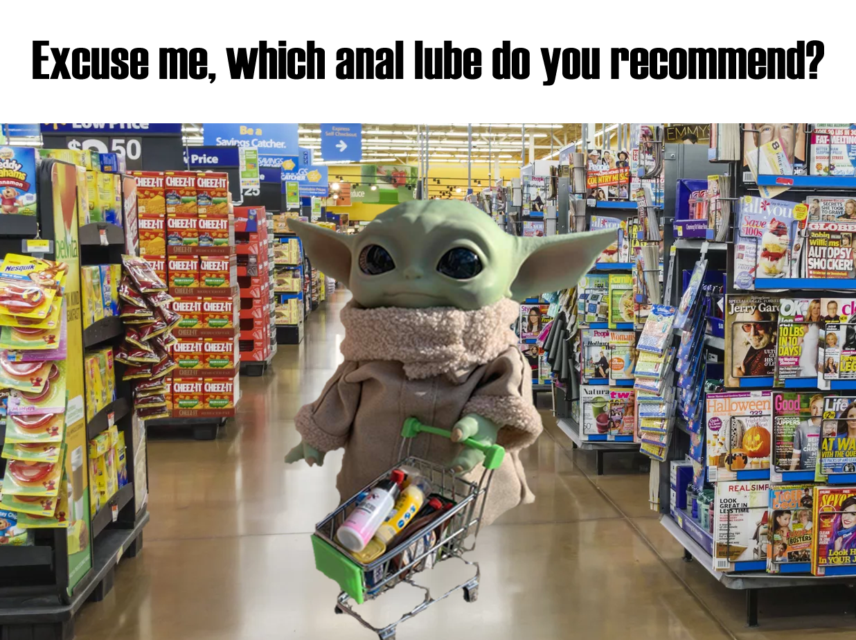 The meme is an image of a character from the Star Wars franchise, Baby Yoda, holding a shopping cart and standing in a grocery store. The text above the image reads, "Excuse me, which anal lube do you recommend?" The humor comes from the unexpected and awkward nature of the question, juxtaposed with the innocent and childlike appearance of Baby Yoda.